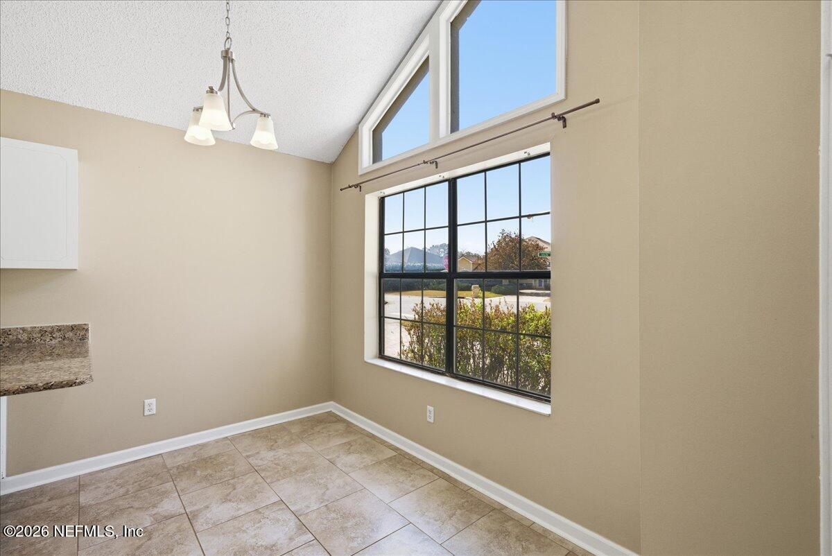 13075 Seedling Way Jacksonville, FL 32246 - Photo 20 of 48 a view of an empty room with a window