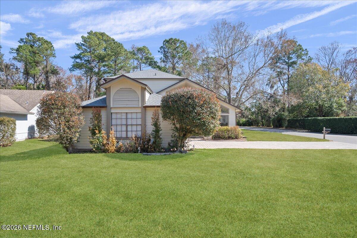 13075 Seedling Way Jacksonville, FL 32246 - Photo 24 of 48 a front view of a house with a garden