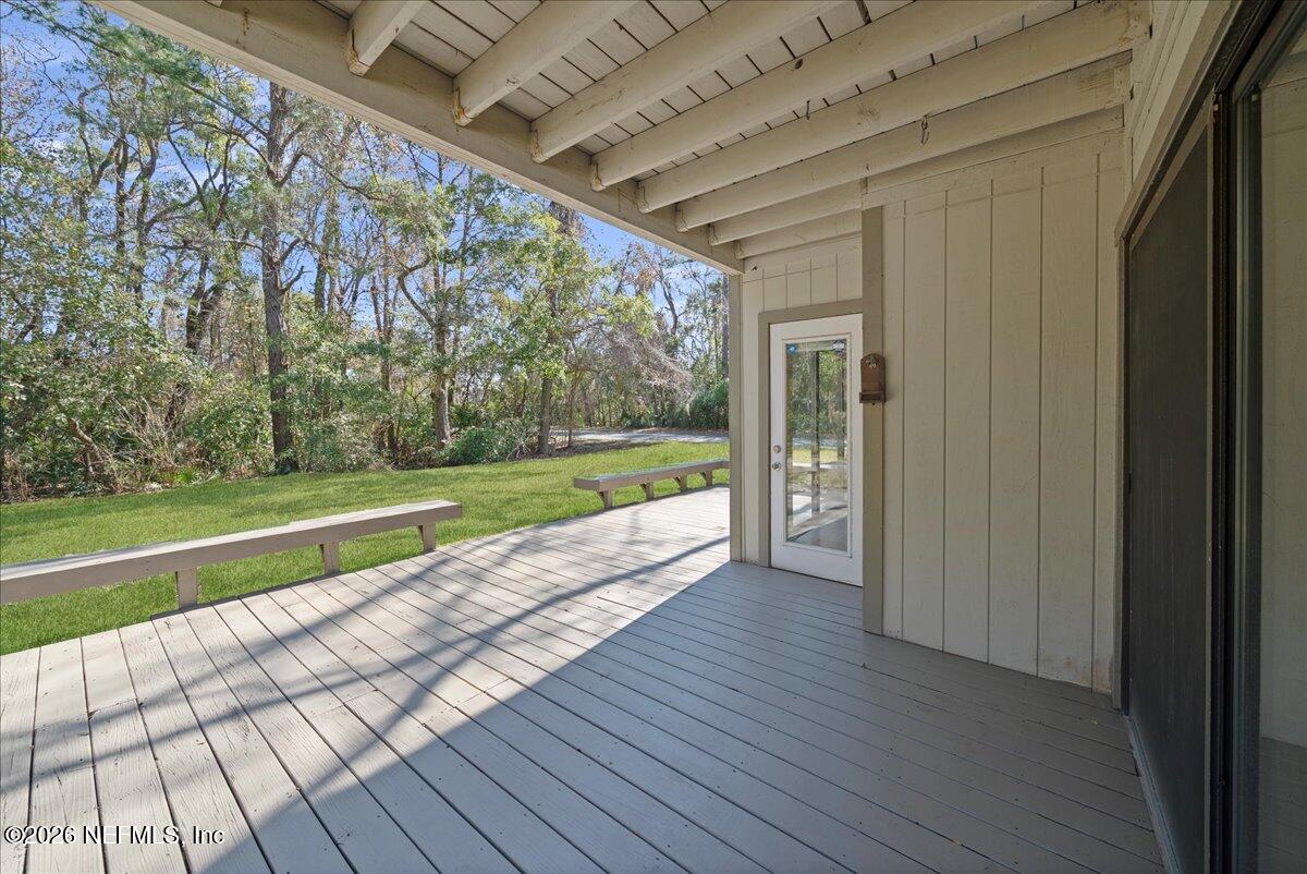 13075 Seedling Way Jacksonville, FL 32246 - Photo 25 of 48 a view of porch with wooden floor and fence