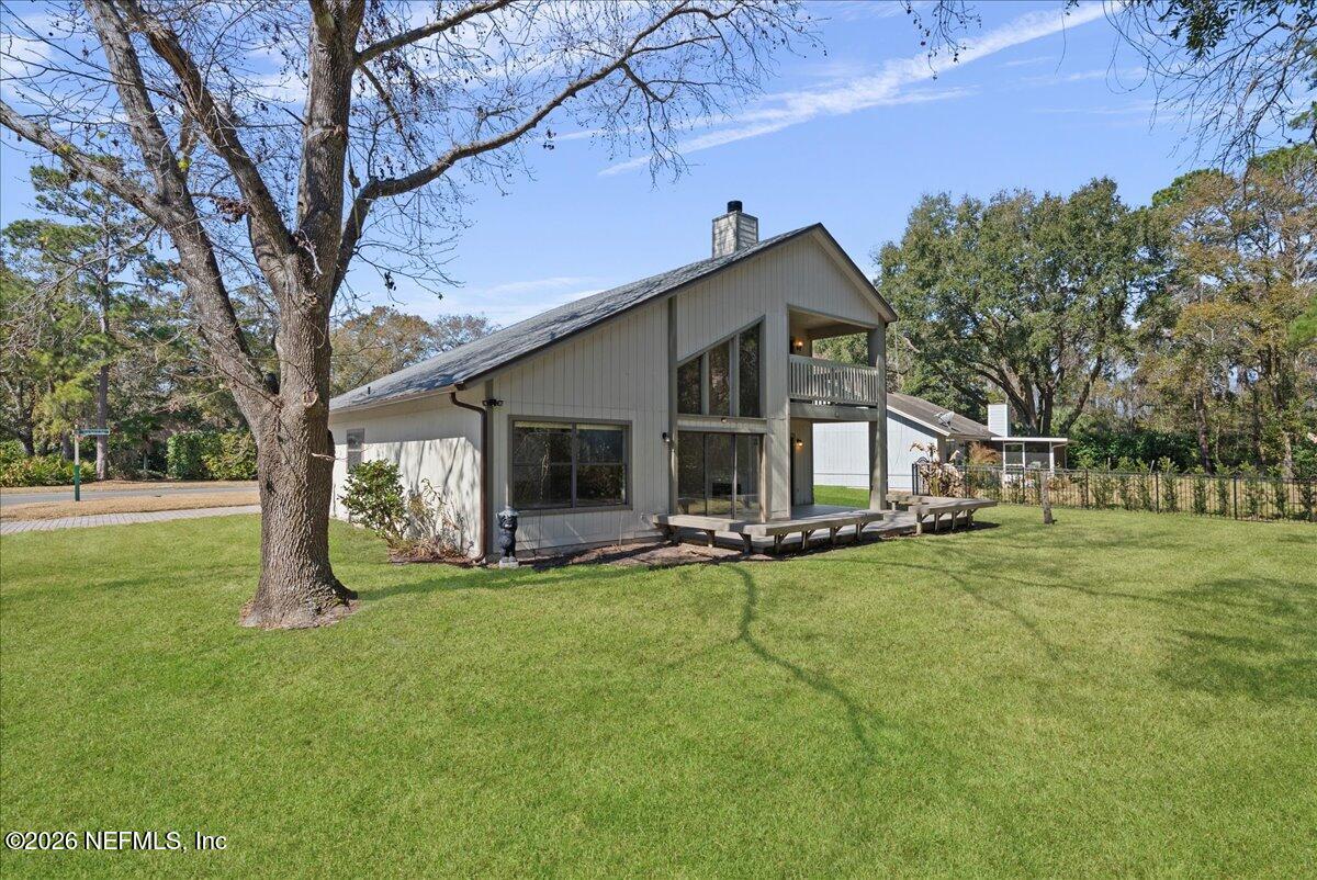13075 Seedling Way Jacksonville, FL 32246 - Photo 32 of 48 a view of a house with a yard and sitting area