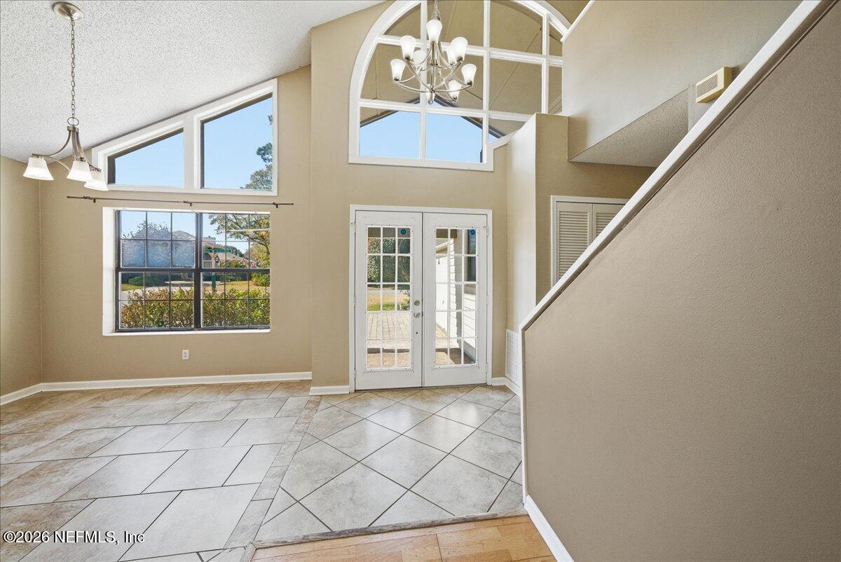 13075 Seedling Way Jacksonville, FL 32246 - Photo 6 of 48 a view of an entryway with staircase
