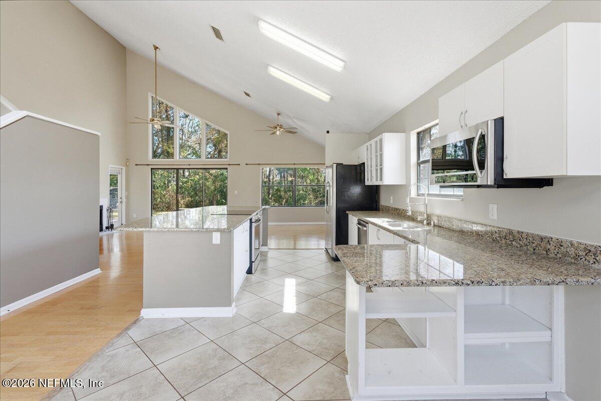 13075 Seedling Way Jacksonville, FL 32246 - Photo 7 of 48 a kitchen with a sink and a counter top space