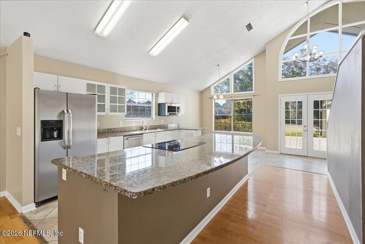 13075 Seedling Way Jacksonville, FL 32246 - Photo 10 of 48 a kitchen with granite countertop a sink and refrigerator