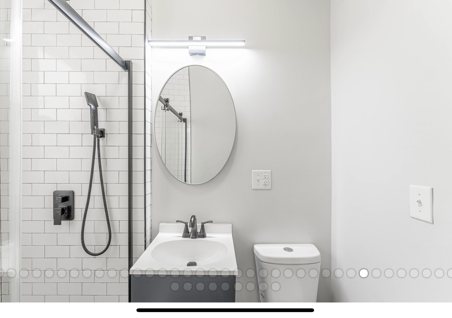 6241 South Troy Street, Unit 2 Chicago, IL 60629 - Photo 11 of 17 a bathroom with a sink mirror and toilet