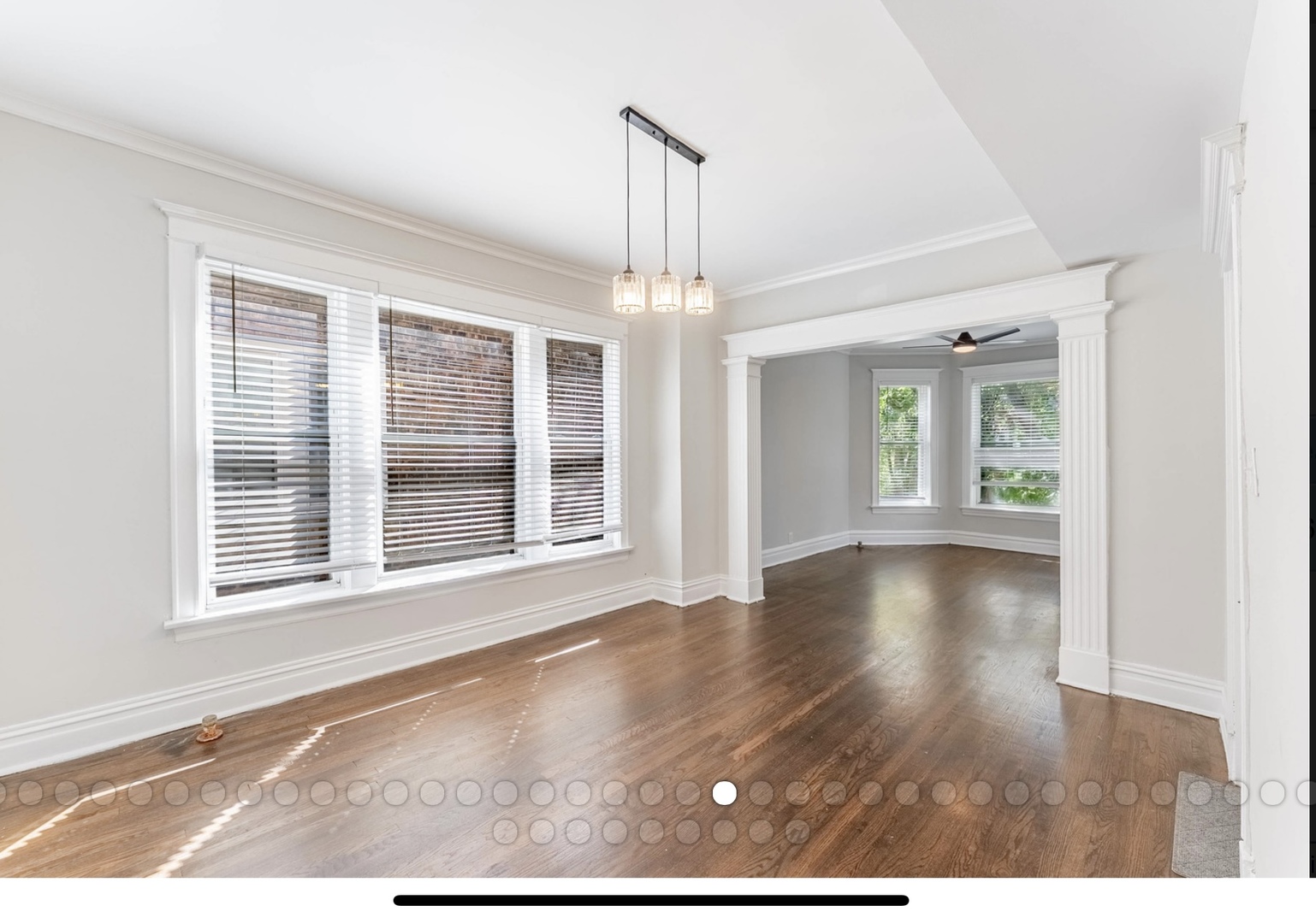 6241 South Troy Street, Unit 2 Chicago, IL 60629 - Photo 7 of 17 a view of an empty room with wooden floor and a window