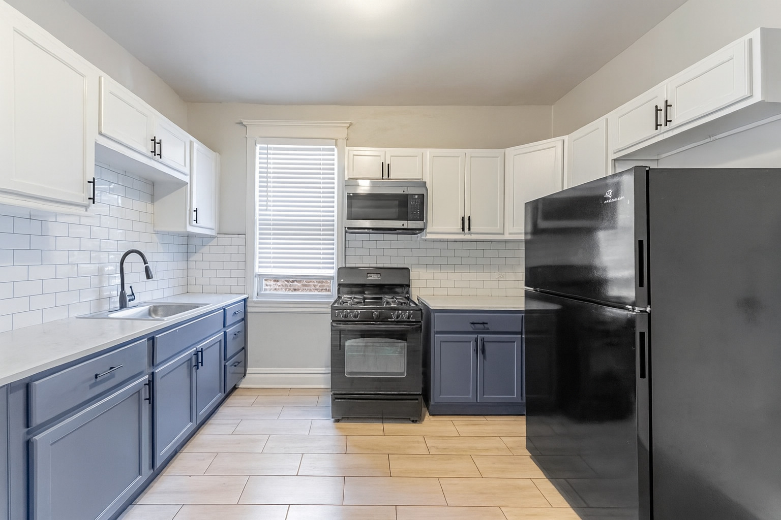 6241 South Troy Street, Unit 2 Chicago, IL 60629 - Photo 8 of 17 a kitchen with a refrigerator sink and stove