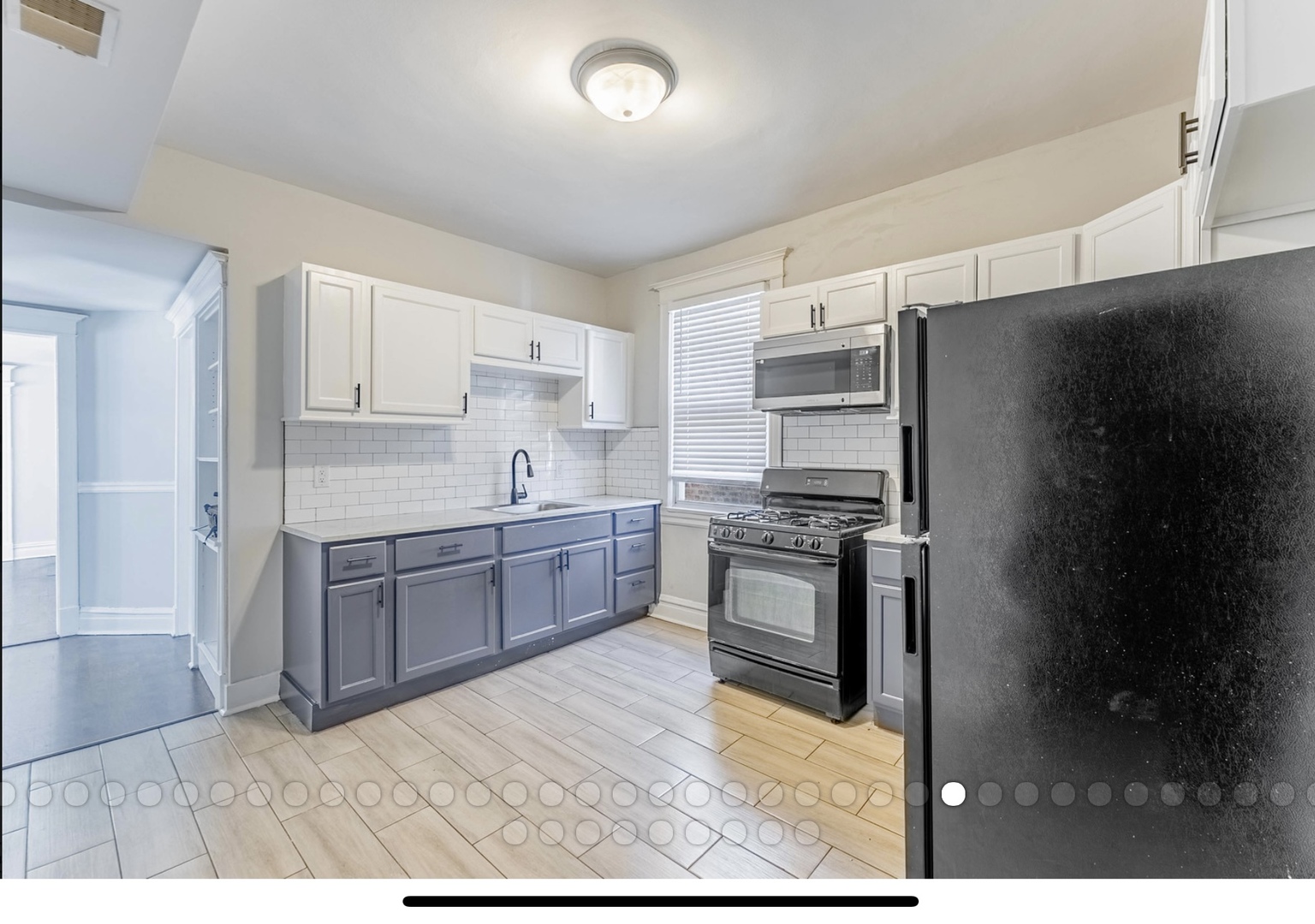 6241 South Troy Street, Unit 2 Chicago, IL 60629 - Photo 9 of 17 a kitchen with stainless steel appliances granite countertop a refrigerator sink and stove