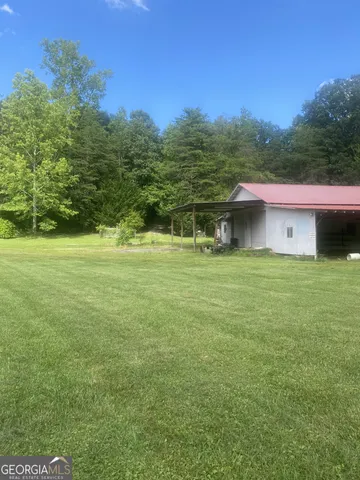 a backyard of a house with lots of green space