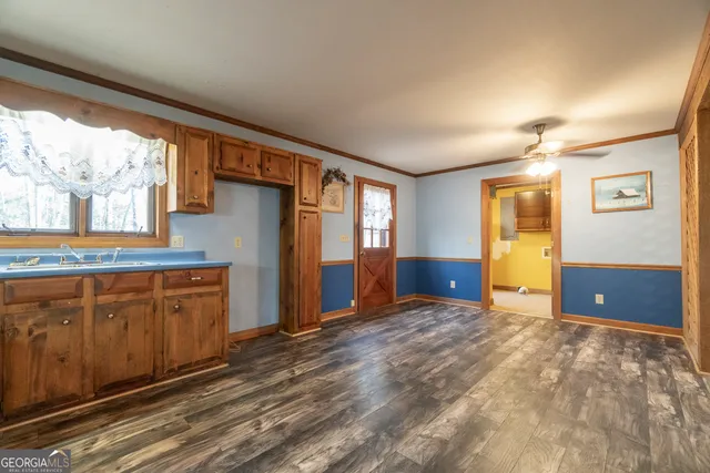 a view of a room with wooden walls