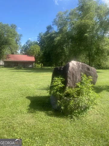 a backyard of a house with lots of green space