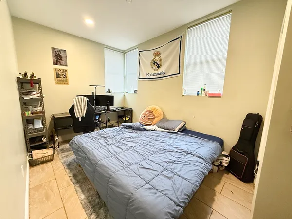 a bedroom with a bed and furniture