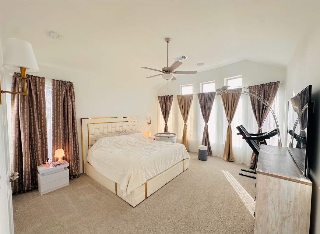 4918 Mango Pk Lane Manvel, TX 77578 - Photo 15 of 28 a bedroom with a bed and large mirror