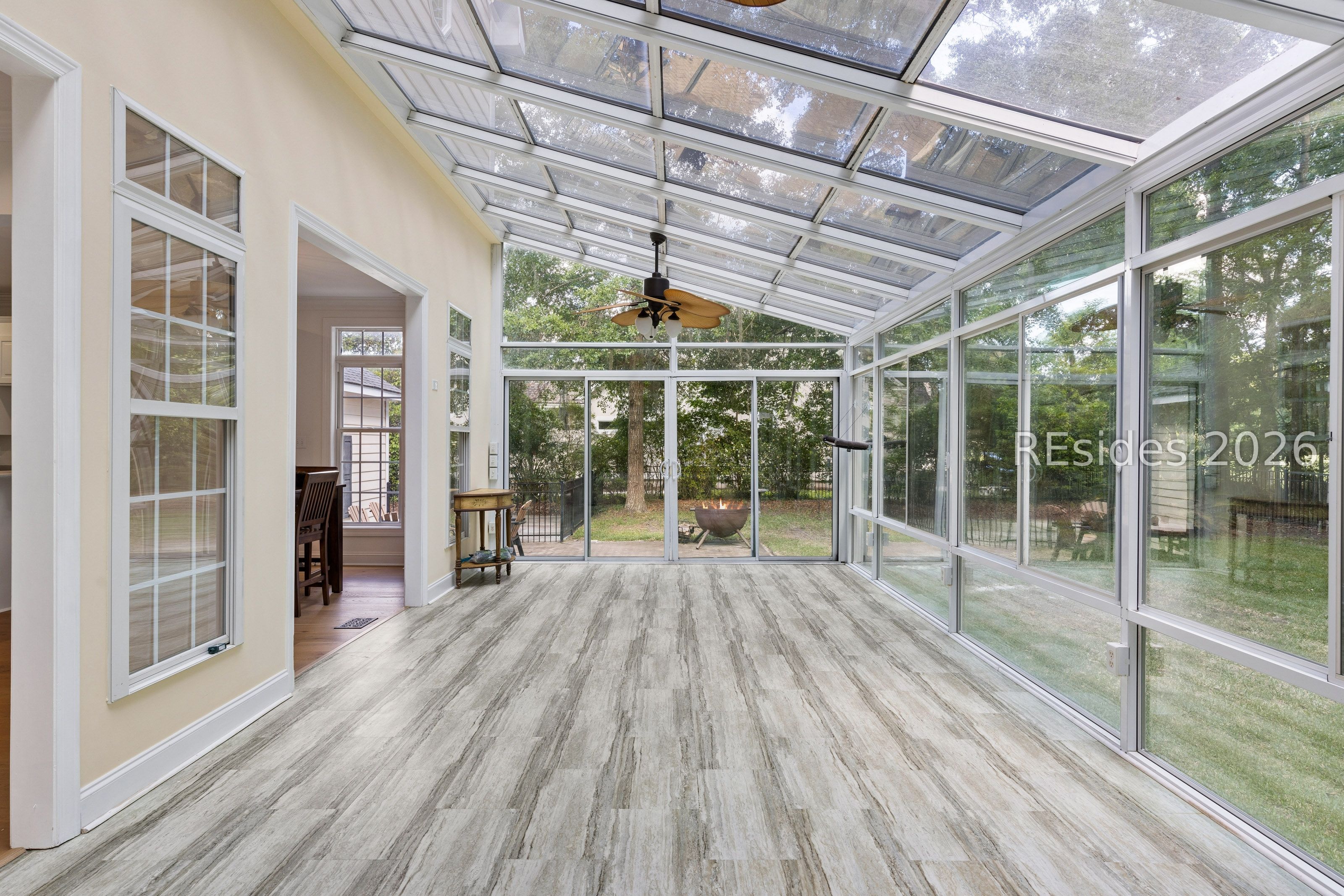 28 Meridian Point Drive Bluffton, SC 29910 - Photo 18 of 65 Carolina room overlooks fenced yard and golf views