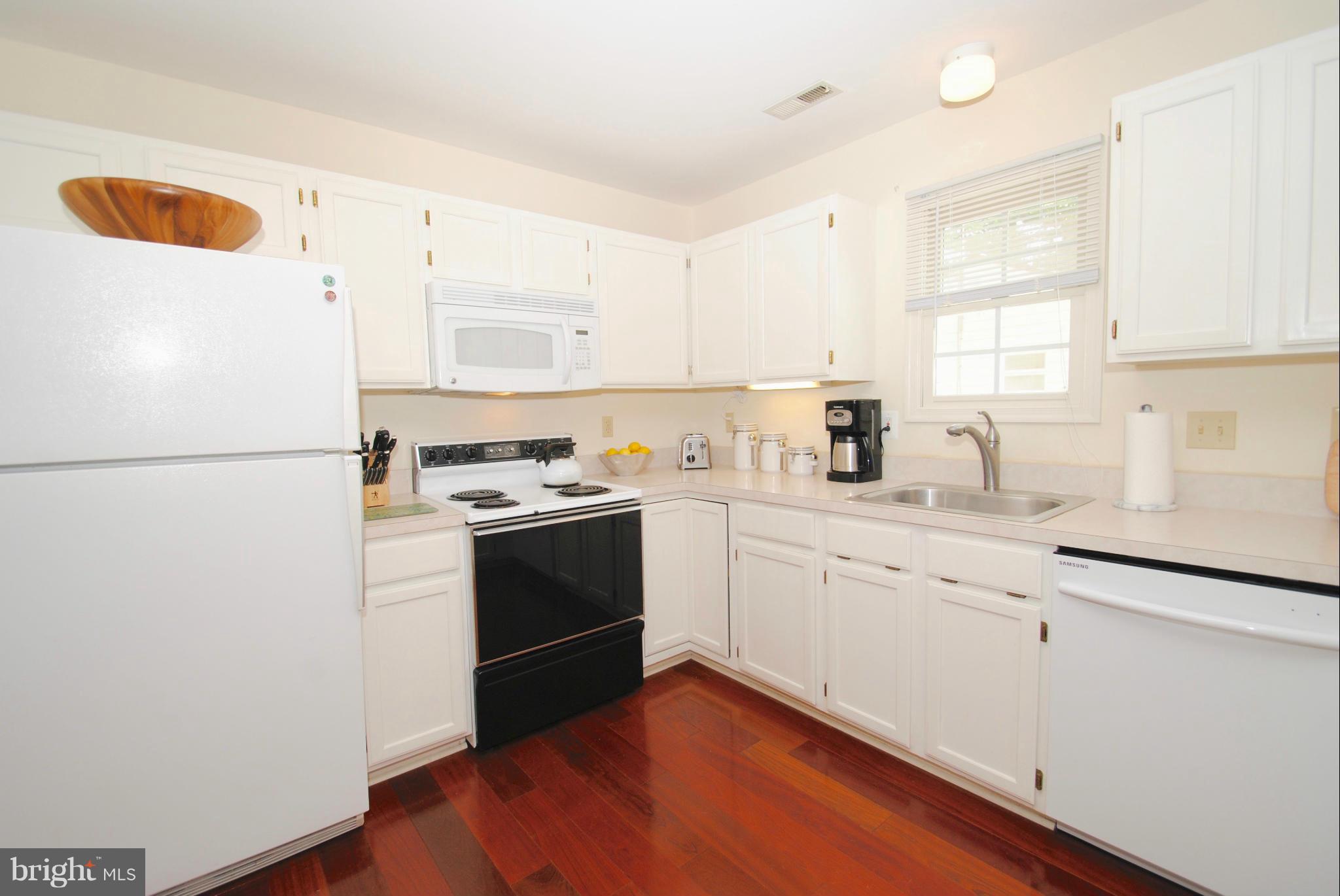 1531 Mayfield Road Edgewater, MD 21037 - Photo 8 of 26 a kitchen with a refrigerator and a sink