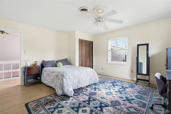a bedroom with bed and window