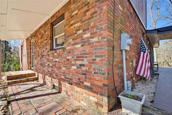 a view of yard with patio