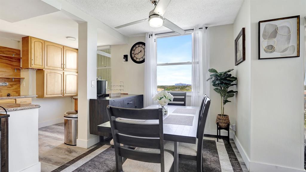 4400 Hillcrest Drive, Unit 719C Hollywood, FL 33021 - Photo 11 of 39 a dining room with furniture and window