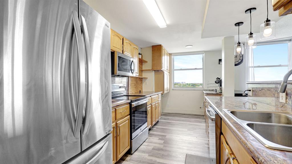 4400 Hillcrest Drive, Unit 719C Hollywood, FL 33021 - Photo 13 of 39 a kitchen with a sink appliances and cabinets