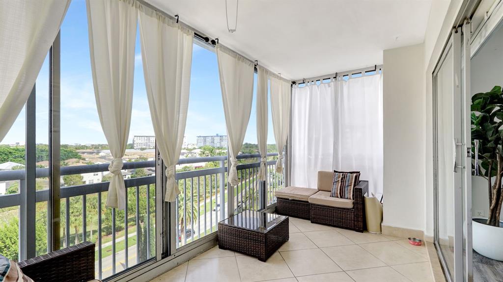 4400 Hillcrest Drive, Unit 719C Hollywood, FL 33021 - Photo 18 of 39 a living room with furniture and a large window
