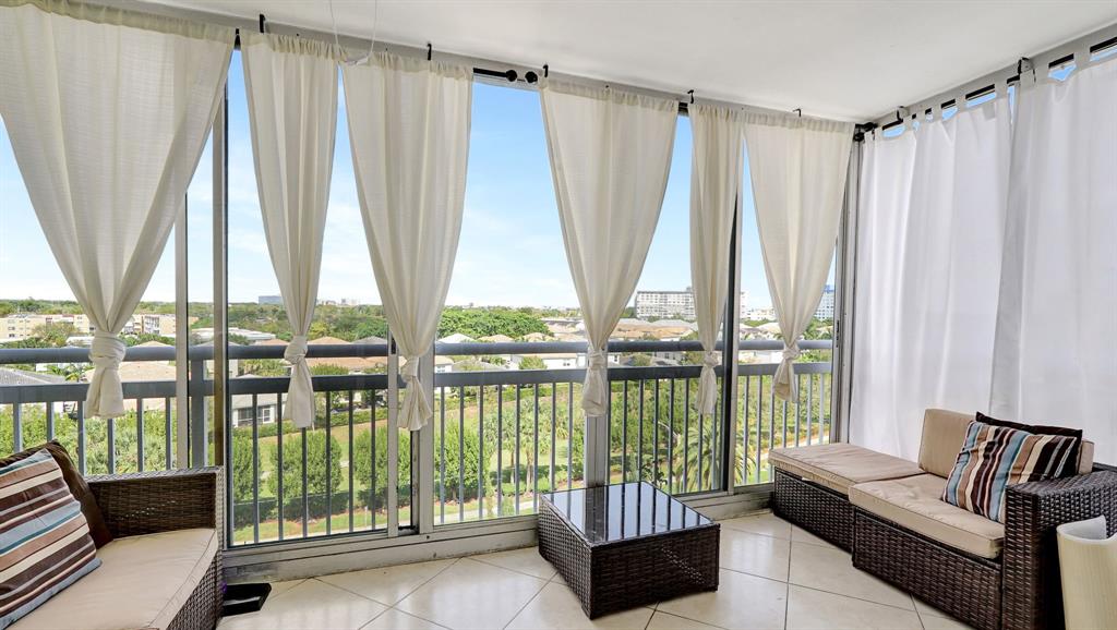4400 Hillcrest Drive, Unit 719C Hollywood, FL 33021 - Photo 19 of 39 a living room with furniture and a large window