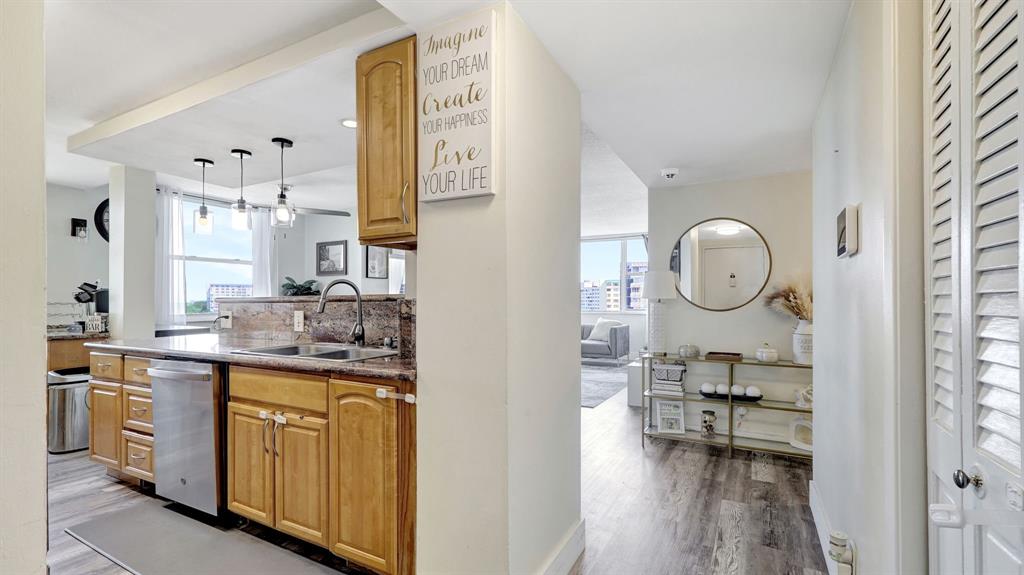 4400 Hillcrest Drive, Unit 719C Hollywood, FL 33021 - Photo 2 of 39 a kitchen with cabinets a sink and a stove