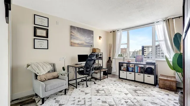 a bedroom with a bed a couch and dresser