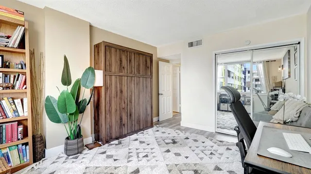 a bedroom with a bed and a couch