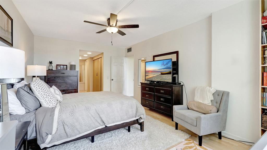 4400 Hillcrest Drive, Unit 719C Hollywood, FL 33021 - Photo 26 of 39 a bedroom with a bed and a couch