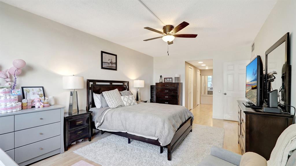 4400 Hillcrest Drive, Unit 719C Hollywood, FL 33021 - Photo 28 of 39 a bedroom with a bed and a flat screen tv