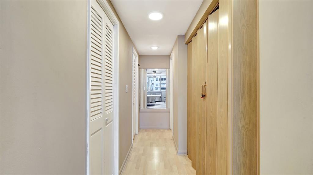 4400 Hillcrest Drive, Unit 719C Hollywood, FL 33021 - Photo 30 of 39 a view of a hallway with wooden shelves