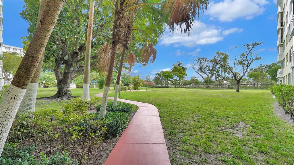 4400 Hillcrest Drive, Unit 719C Hollywood, FL 33021 - Photo 34 of 39 a view of a garden with an trees