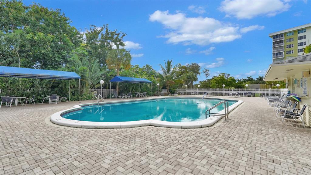 4400 Hillcrest Drive, Unit 719C Hollywood, FL 33021 - Photo 38 of 39 a view of a swimming pool with a yard