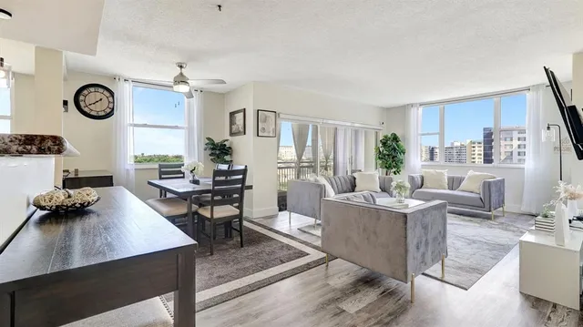 a view of a dining room with furniture window and wooden floor