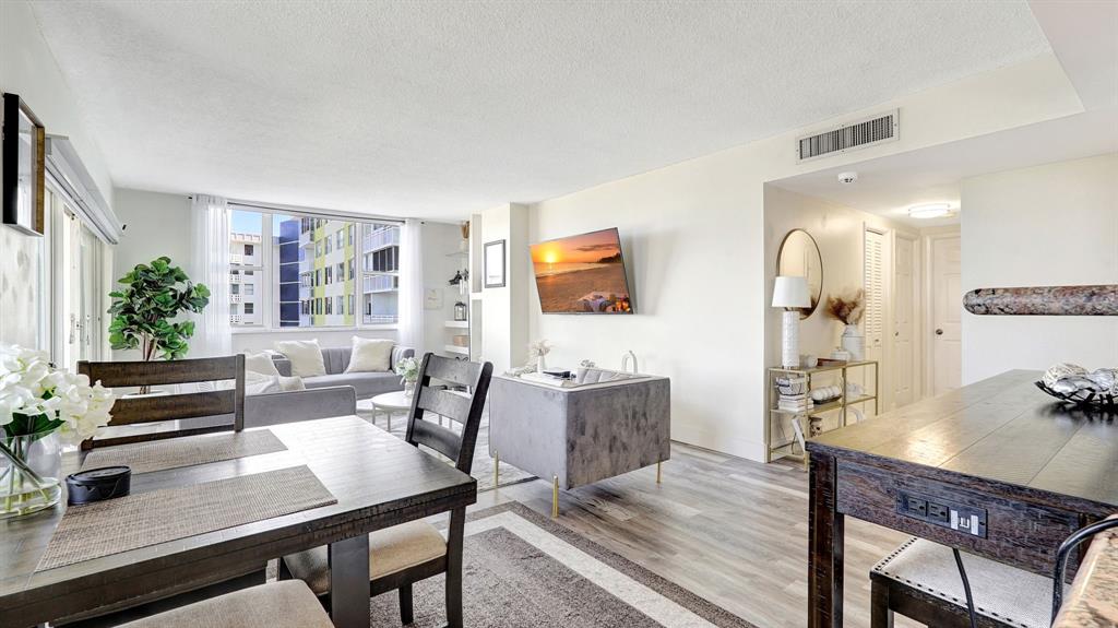 4400 Hillcrest Drive, Unit 719C Hollywood, FL 33021 - Photo 9 of 39 a view of a dining room with furniture window and wooden floor