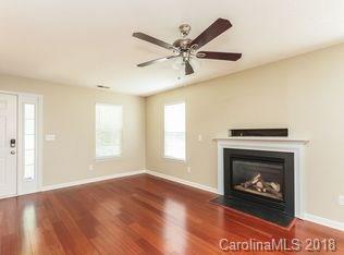 15276 Tracy Beth Road Huntersville, NC 28078 - Photo 2 of 10 a living room with furniture and a fireplace