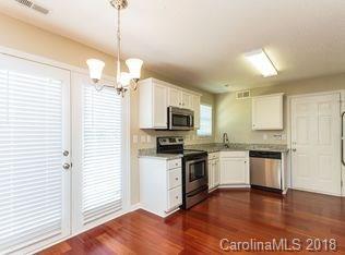 15276 Tracy Beth Road Huntersville, NC 28078 - Photo 5 of 10 a kitchen with stainless steel appliances granite countertop a refrigerator a stove top oven a sink and dishwasher