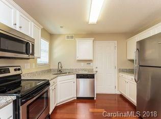 15276 Tracy Beth Road Huntersville, NC 28078 - Photo 6 of 10 a kitchen with stainless steel appliances a sink cabinets and wooden floor