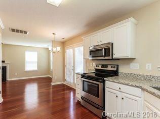 15276 Tracy Beth Road Huntersville, NC 28078 - Photo 7 of 10 a kitchen with granite countertop a stove and a microwave