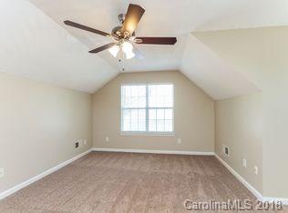 15276 Tracy Beth Road Huntersville, NC 28078 - Photo 9 of 10 an empty room with windows and fan