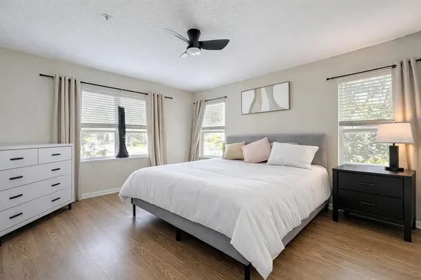 a bedroom with a bed and a window