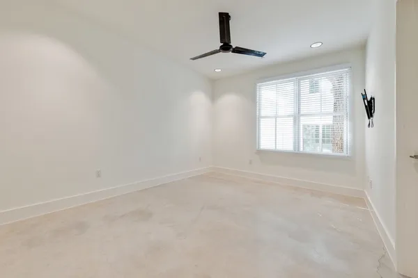 a bathroom with a toilet a sink a mirror a bathtub and vanity