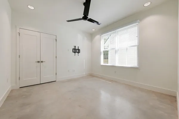 a bathroom with a granite countertop sink toilet a large mirror a bathtub and shower