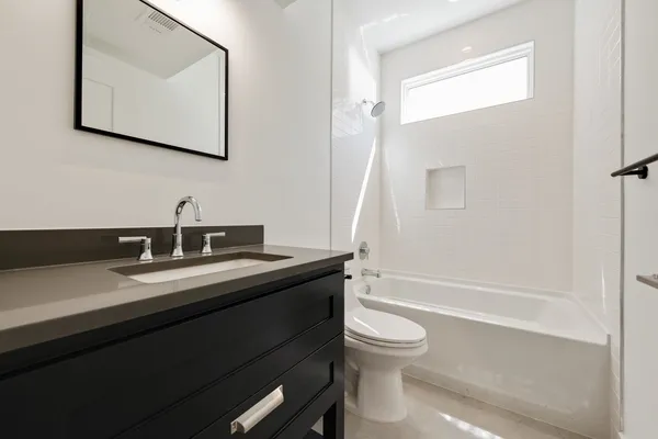 a view of a room with a ceiling fan