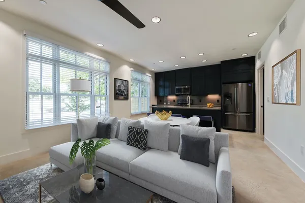 a living room with furniture and a large window