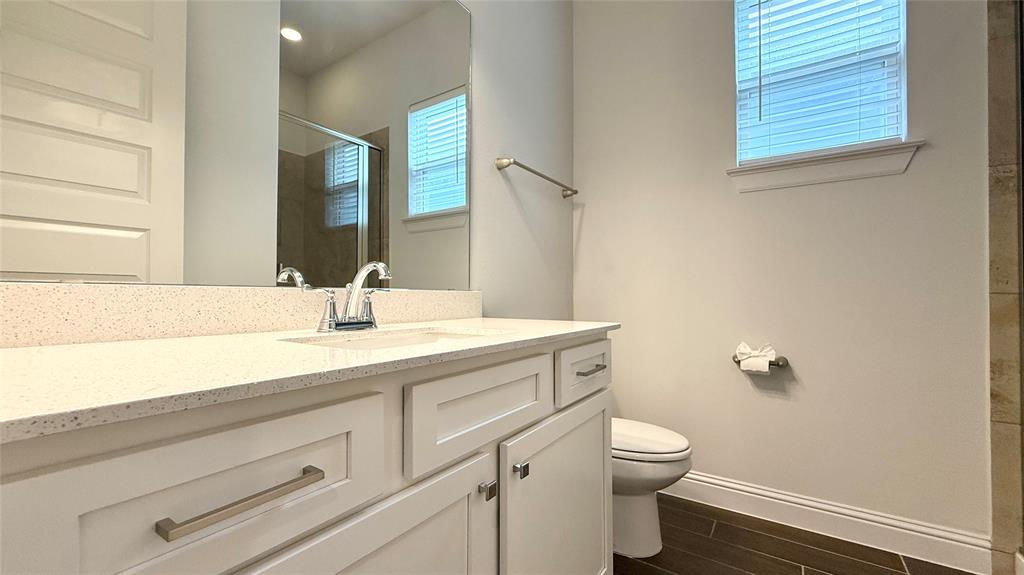 601 C-Bar Ranch Trail, Unit 27 Cedar Park, TX 78613 - Photo 24 of 29 Bathroom featuring a white vanity with a light-toned countertop, undermount sink, and chrome faucet