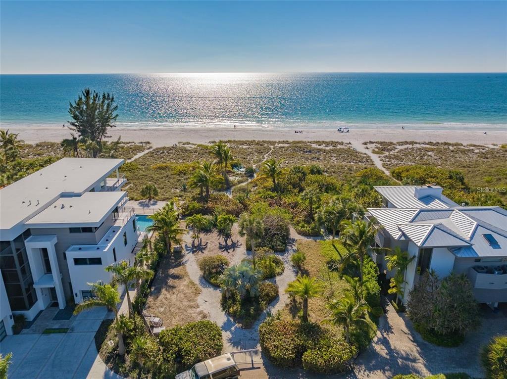 102 Sunset Lane Holmes Beach, FL 34217 - Photo 1 of 14 an aerial view of residential houses with outdoor space