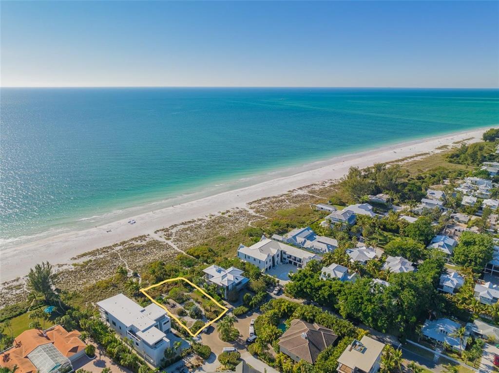 102 Sunset Lane Holmes Beach, FL 34217 - Photo 4 of 14 an aerial view of residential houses with outdoor space