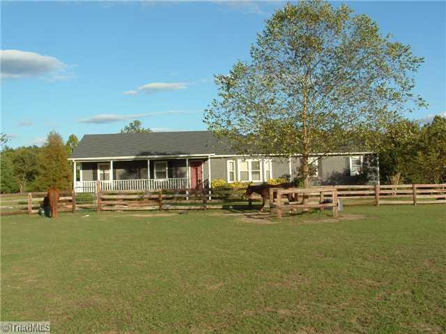 2254 Cullen Road Gibsonville, NC 27249 - Photo 1 of 16 Exterior Front. Lovely cedar sided ranch on 10+ acres in Gibsonville