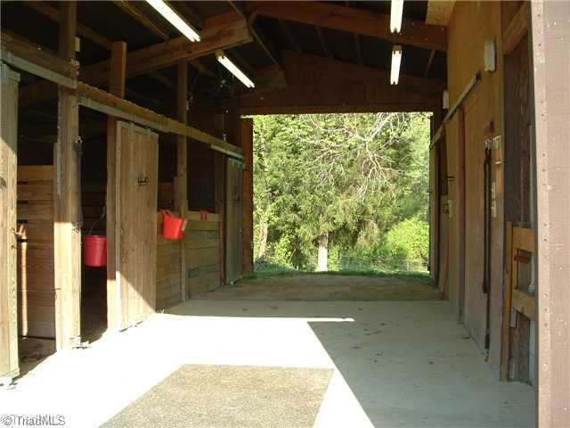 2254 Cullen Road Gibsonville, NC 27249 - Photo 14 of 16 Storage. Interior of barn. 4 Stalls, rubber mats, wash room with hot and cold water, tack room