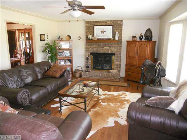 2254 Cullen Road Gibsonville, NC 27249 - Photo 3 of 16 Living Room. Great room with full masonry fileplace, gas logs, hardwood floors, bay window